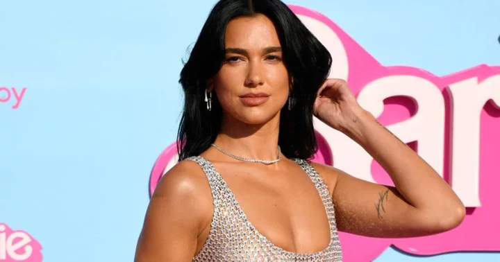 Dua Lipa flaunts toned body in sheer chainmail gown at star-studded 'Barbie' premiere in LA
