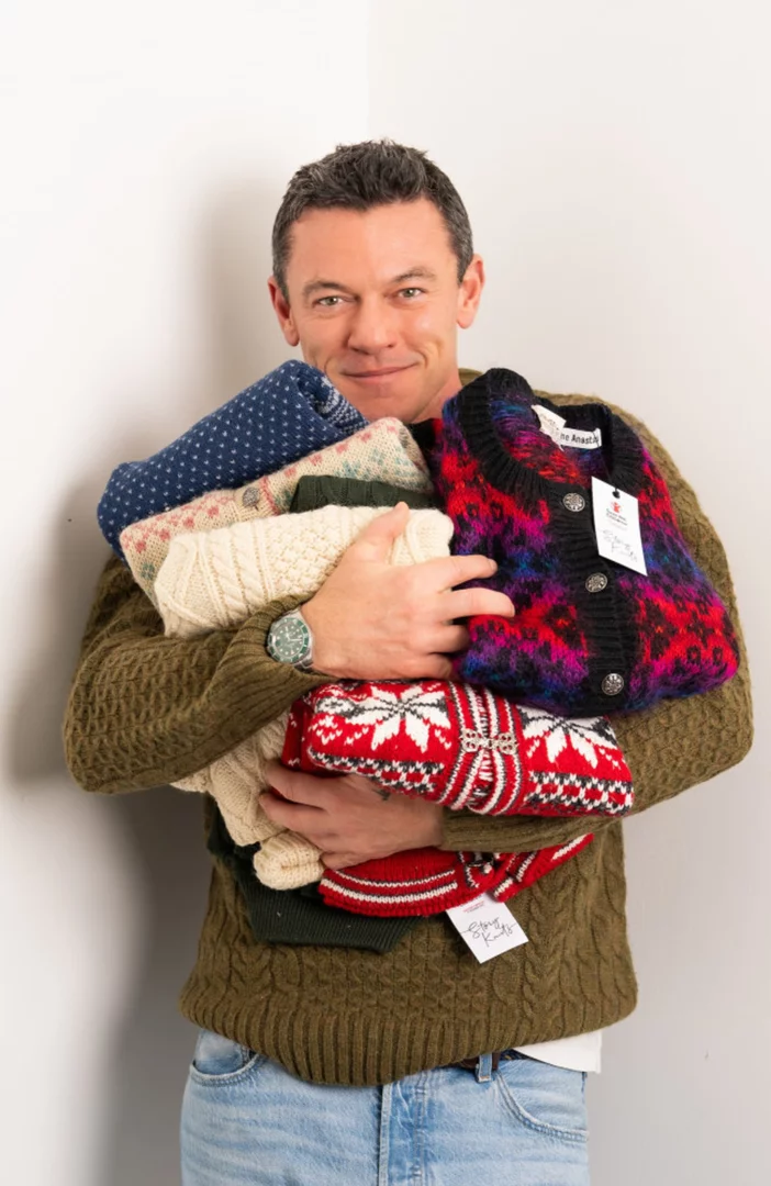 Luke Evans is 'in a festive mood' with Christmas knitwear