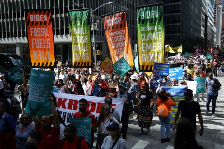 Climate protesters throng New York, demand end to fossil fuels