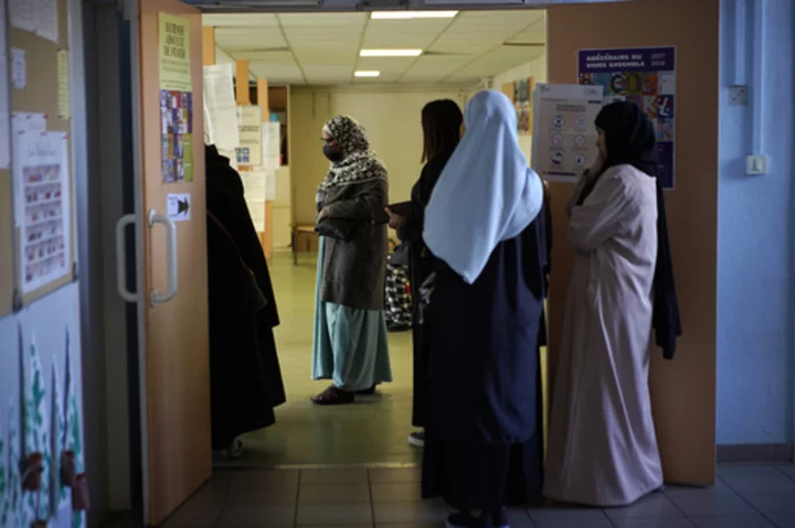 France's education minister bans long robes in classrooms worn mainly by Muslims