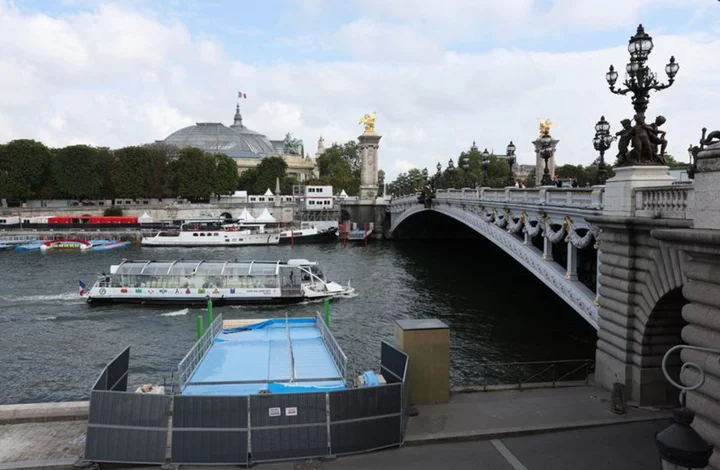 Pre-Olympics women's swimming event postponed as storms dirty Seine river