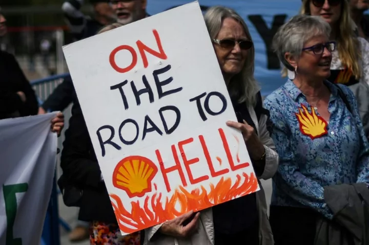 Climate protestors disrupt Shell shareholder meet