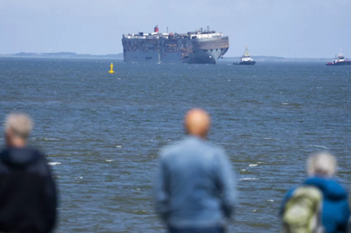 A car-carrying ship that burned for a week on the North Sea will be towed to a Dutch port