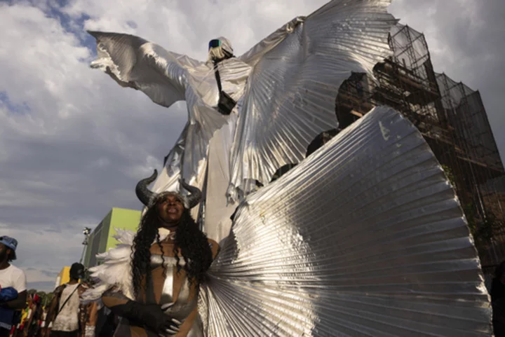 West Indian American Day Parade steps off with steel bands, colorful costumes, stilt walkers