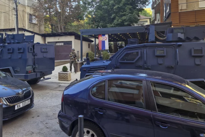 Kosovo police conduct raids in Serb-dominated north following clashes that left 4 dead on weekend