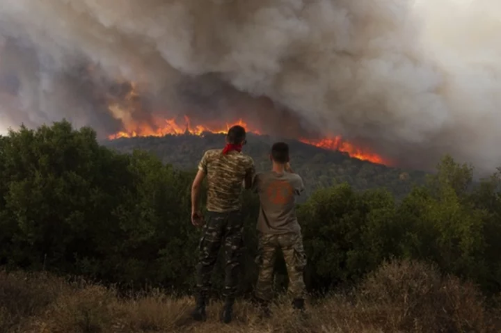 Firefighters in Greece struggle to control blazes in country's northeast and near Athens