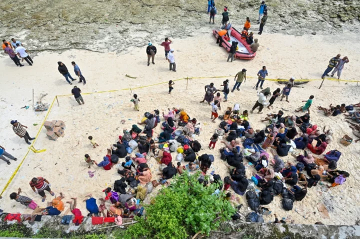 Huddled on an Indonesian beach, stranded Rohingya plead for mercy