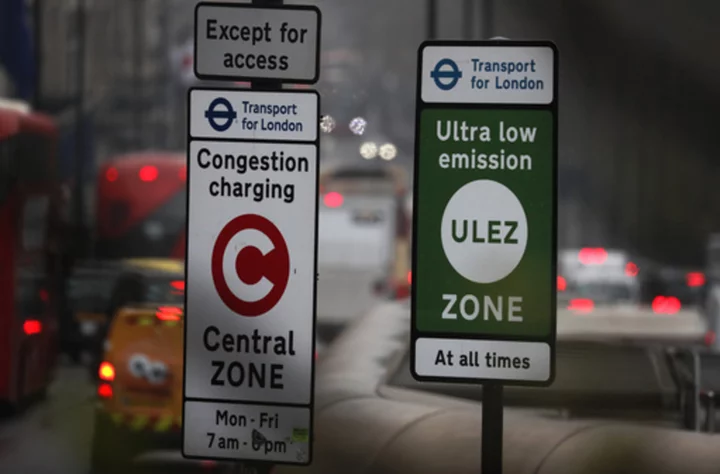 A pollution tax on older cars can be extended to London's suburbs after a British court ruling