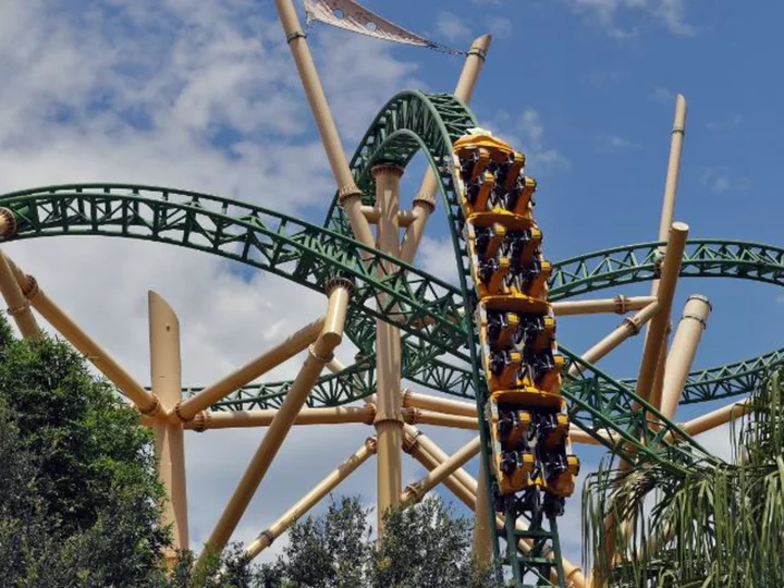 Man arrested after breaking into Florida theme park, hopping into alligator enclosure and filming video for social media, authorities say