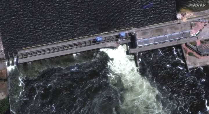 Kakhovka dam in southern Ukraine is blown, unleashing flood of water