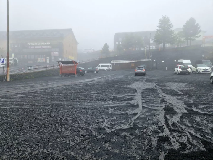 Flights stopped as Mount Etna eruptions coat Catania city and airport in thick layer of ash