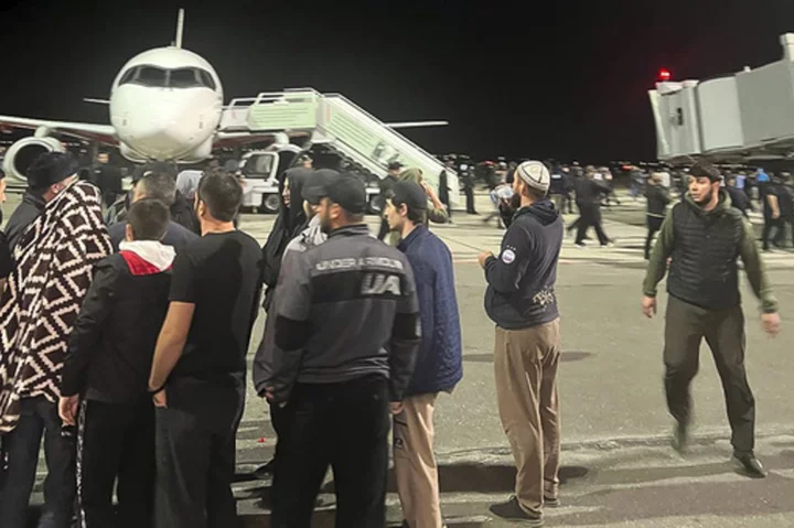 Hundreds storm airport in Russia in antisemitic riot over arrival of plane from Israel