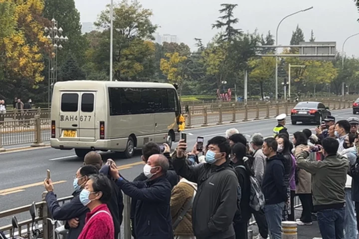 Crowds gather near a state funeral home as China's former Premier Li Keqiang is put to rest