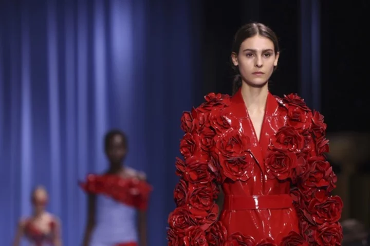 Following theft, Balmain shows defiance with flowers in rose-filled Paris Fashion Week show