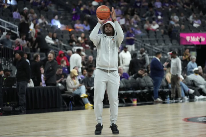 Bronny James mostly watches warmups with his No. 23 Southern California teammates