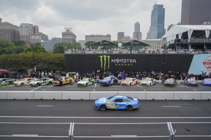 Heavy rains flood Chicago roads, NASCAR ends downtown street race and names winner