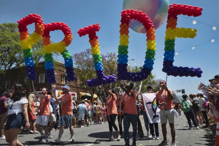 California Gov. Gavin Newsom signs bills to enhance the state's protections for LGBTQ+ people