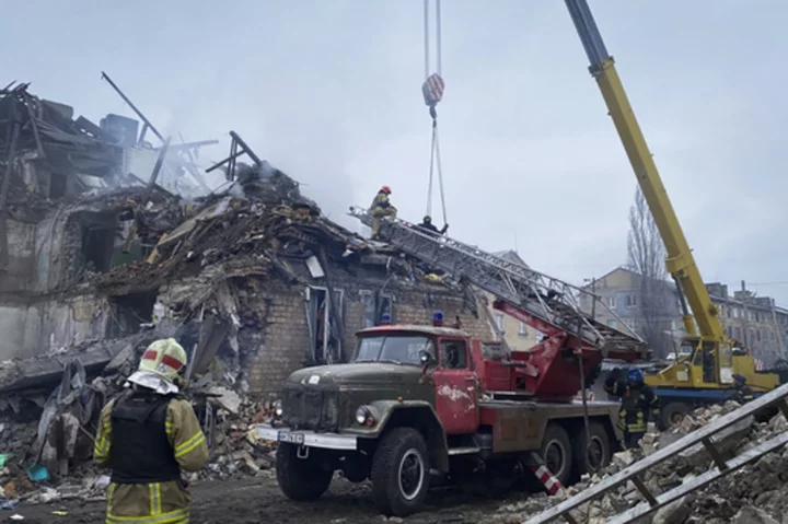 Russian missile strikes in eastern Ukraine tear through buildings and bury families in rubble