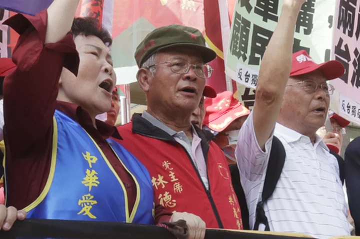 Taiwan indicts 2 communist party members accused of colluding with China to influence elections