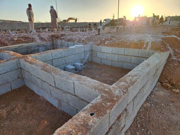 'This is God's will.' Survivors dig mass graves for those killed in Libya's devastating floods