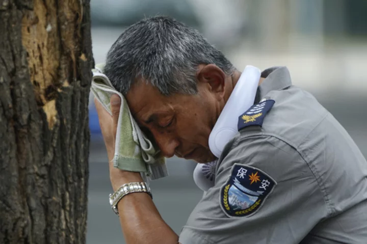 Flooding displaces 10,000 around China as Beijing gets a relative respite from sweltering heat