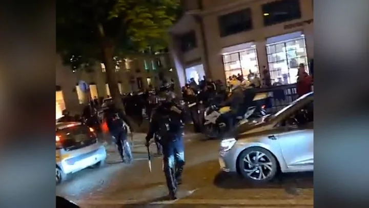 Riot police deployed on Champs-Elysees after funeral of teenager shot by police