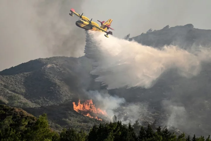 Greece faces new heatwave as wildfires rage