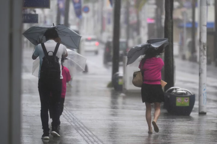 Weakened Tropical Storm Mawar brings heavy rains to Japan's southern islands as it passes by