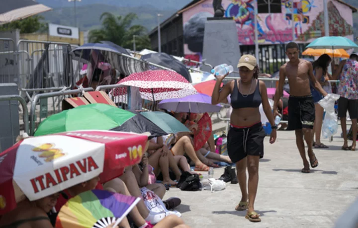 Taylor Swift postpones Rio de Janeiro show, citing record heat a day after fan dies during concert