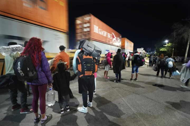 Migrants hoping to reach US continue north through Mexico by train amid historic migration levels