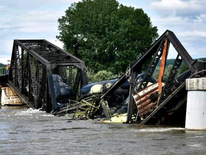 Train derailment on Montana bridge sends multiple rail cars into the Yellowstone River