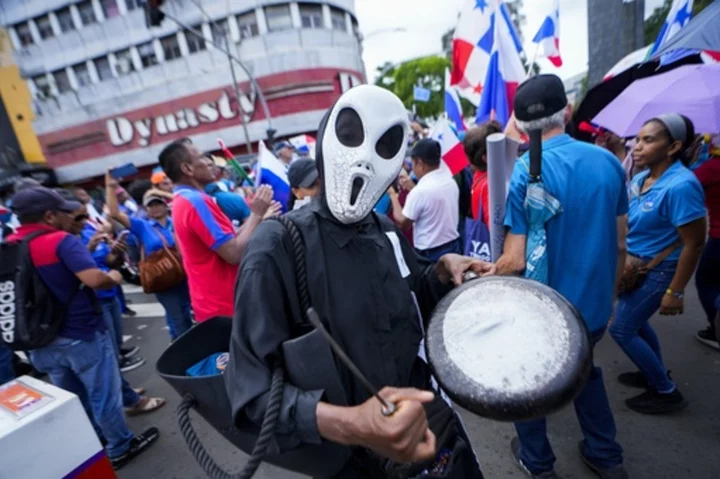 Panama's leader calls for referendum on mining concession, seeking to calm protests over the deal