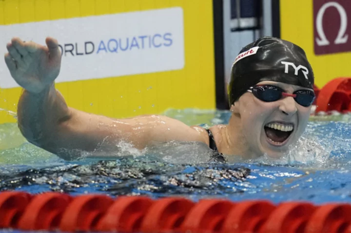 Ledecky wins gold at the swimming worlds to tie mark set by Phelps