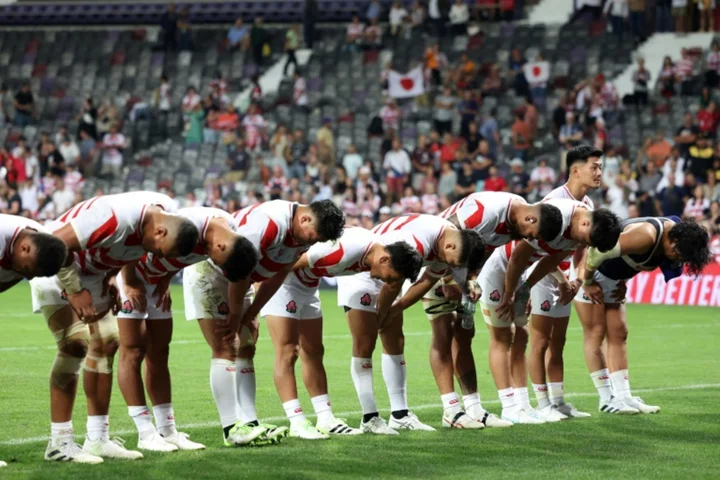 Japan win 'arm wrestle' to set up showdown for last-eight place