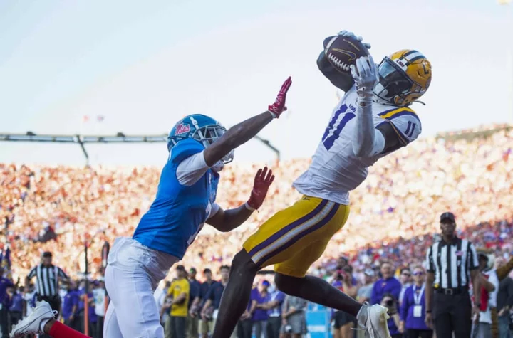 Ole Miss fans throw trash on field after controversial LSU TD during win