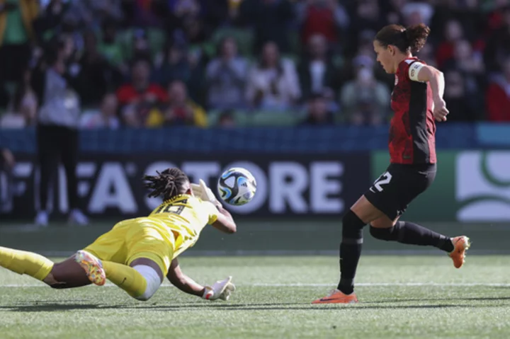 Nigeria's Nnadozie denies Canada's prolific scorer Sinclair in a 0-0 draw at the Women's World Cup