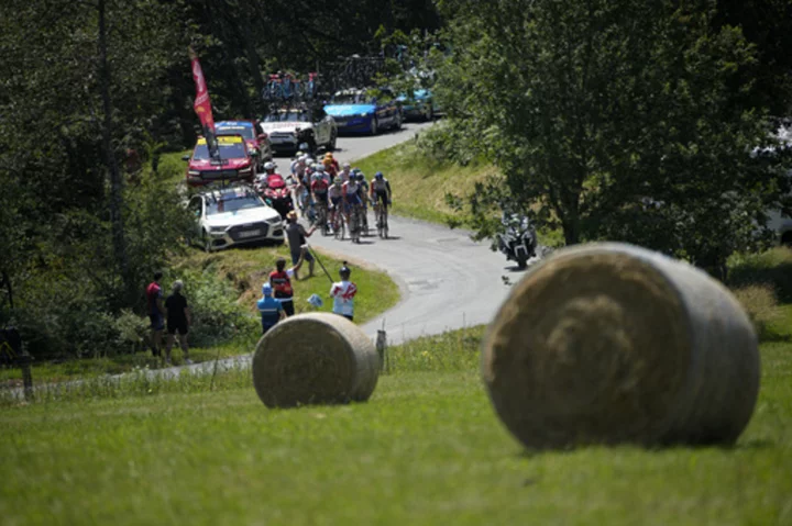 Canadian Michael Woods secures biggest career win at the top of legendary Tour mountain