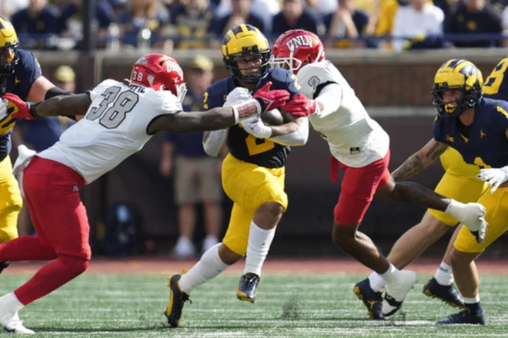 No. 2 Michigan rolls on without suspended coach Jim Harbaugh, routing UNLV 35-7