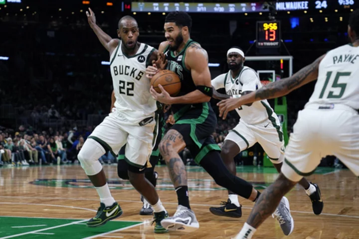 Tatum shakes off illness, helps Celtics slow Giannis and beat fellow East power Bucks 119-116