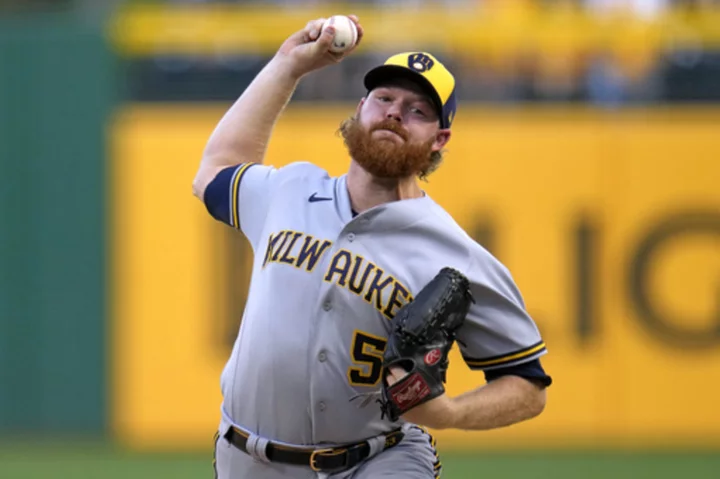 Brandon Woodruff pitches seven scoreless innings to lift NL Central-leading Brewers over Pirates 7-3