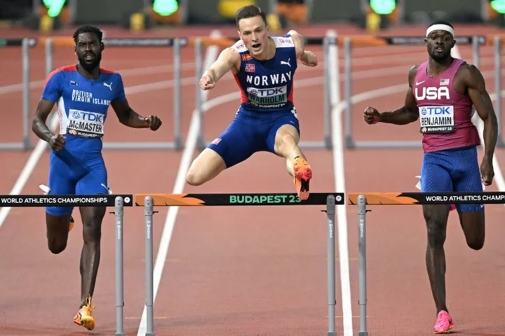 Norway's Karsten Warholm wins third world 400m hurdles title