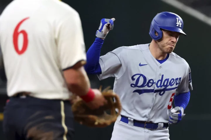 Dodgers beat Texas 11-5 in return to Globe Life Field, where they won 2020 World Series; Seager hurt