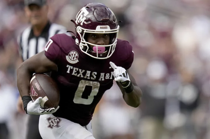 Johnson throws for 249 yards and TD as Texas A&M gets 30-17 win over South Carolina