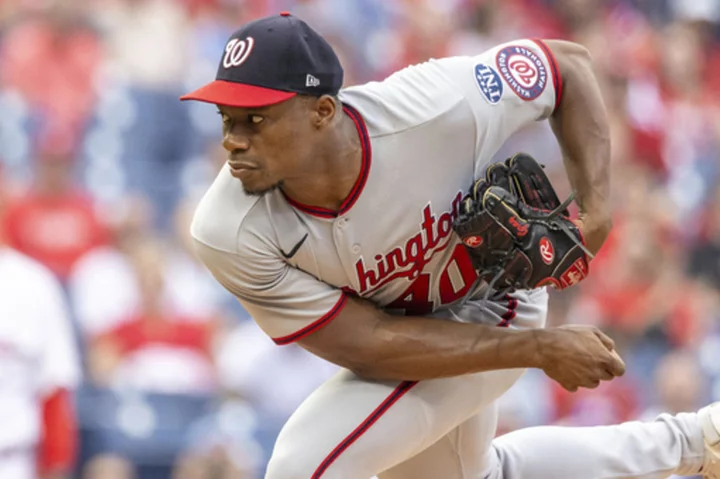 Garrett hits 2-run homer and Gray fans 8 to lead the Nationals past Phillies 2-1