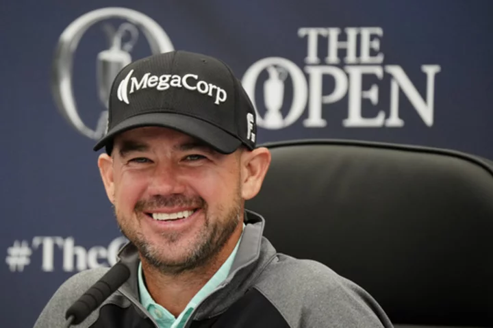 Harman matches British Open records at Hoylake to build a big lead