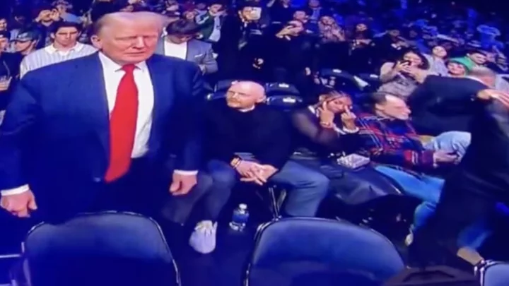 Bill Burr's Wife Nia Renee Hill Flips Off Donald Trump on Jumbotron at UFC 295