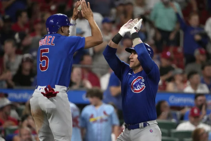 Happ, Gomes homer to help the Cubs beat the Cardinals 5-1 for their 8th straight victory