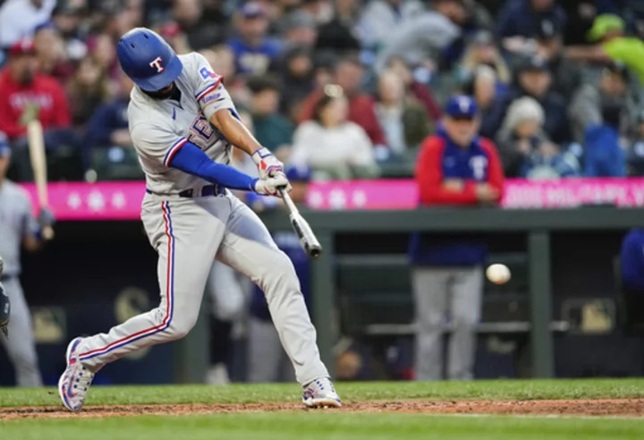 Rangers finally get to Gilbert, top Mariners 2-1 behind Gray