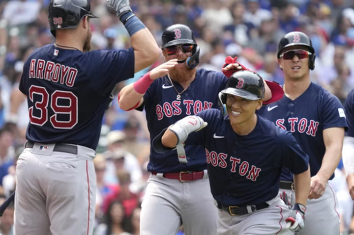 Yoshida hits a grand slam and drives in 6 as the Red Sox rout the Cubs 11-5 behind Crawford