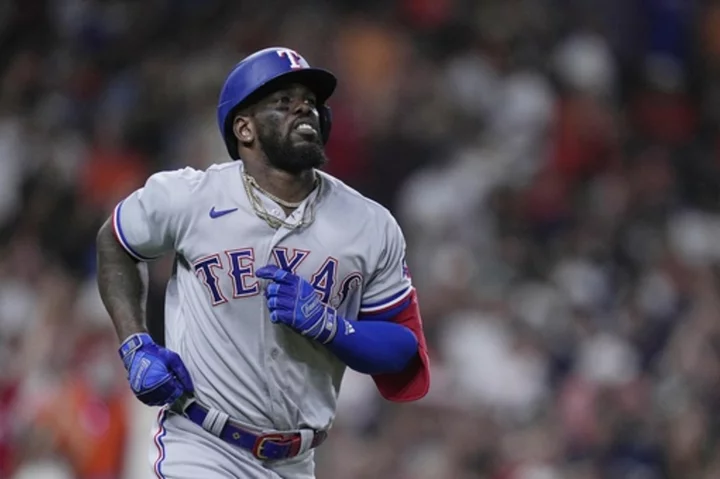 García's grand slam highlights 4-homer game as AL West-leading Rangers beat Astros 13-5